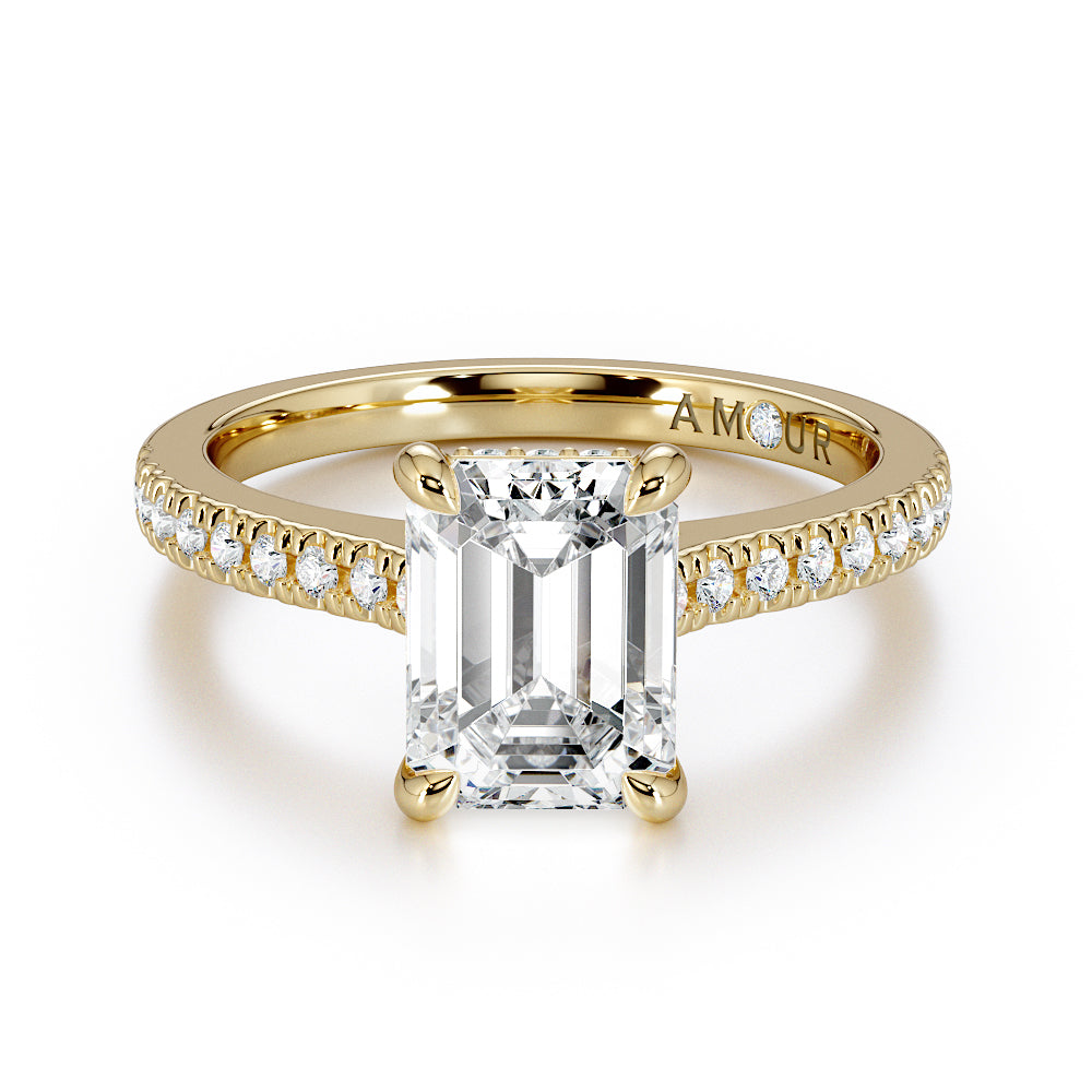 Emerald cut with pave set diamond shoulders and hidden halo