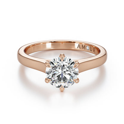 Brilliant cut six claw solitaire with cathedral shoulders