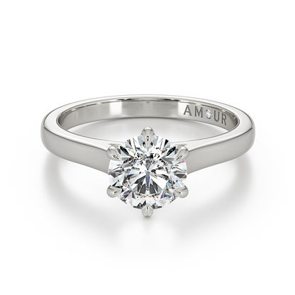 Brilliant cut six claw solitaire with cathedral shoulders