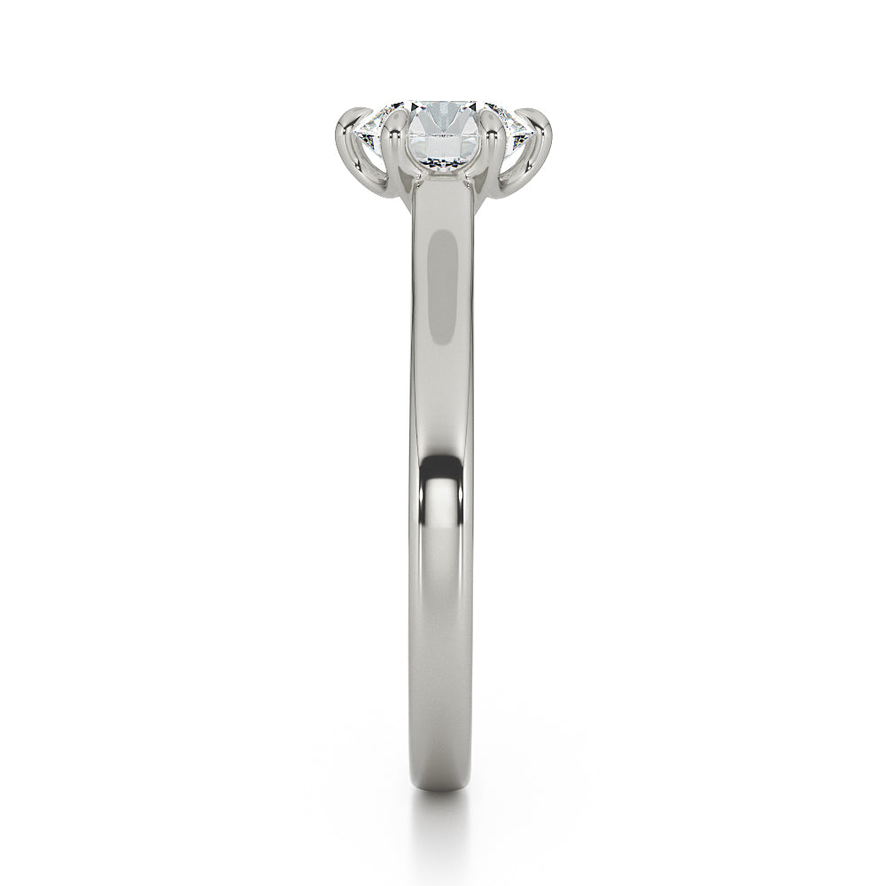 Brilliant cut six claw solitaire with cathedral shoulders