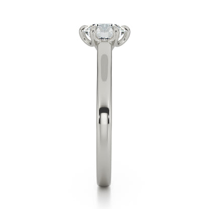 Brilliant cut six claw solitaire with cathedral shoulders