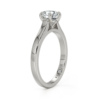 Brilliant cut six claw solitaire with cathedral shoulders
