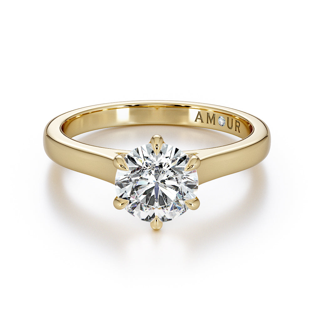 Brilliant cut six claw solitaire with cathedral shoulders