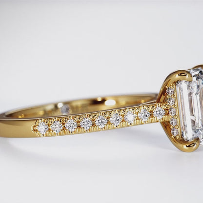 Emerald cut with pave set diamond shoulders and hidden halo