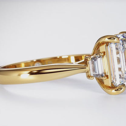 Emerald cut with trapezoid cut shoulder stones