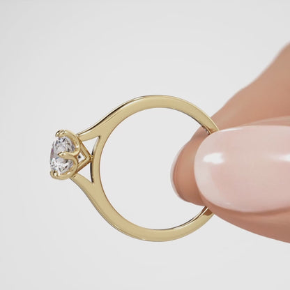 Brilliant cut six claw solitaire with cathedral shoulders